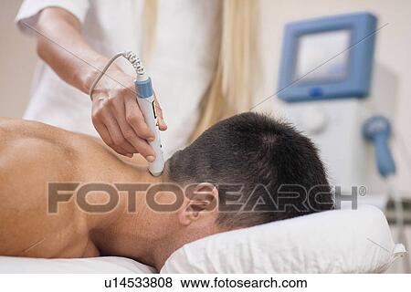 Physiotherapy laser treatment View Large Photo Image Stock Photo - Physiotherapy laser treatment. Fotosearch