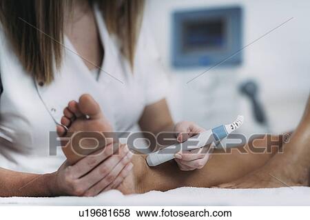 Physiotherapy laser treatment View Large Photo Image Stock Photo - Physiotherapy laser treatment. Fotosearch