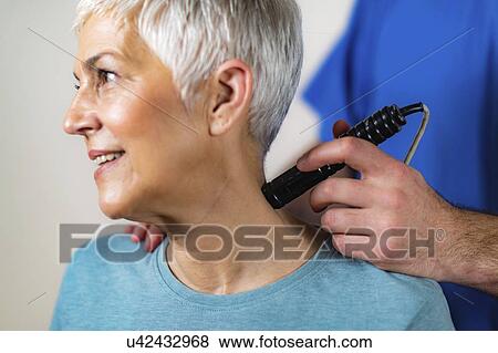 Physiotherapy laser treatment View Large Photo Image Stock Photo - Physiotherapy laser treatment. Fotosearch
