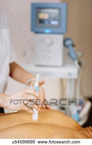Stock Photo - Physiotherapy laser treatment. Fotosearch