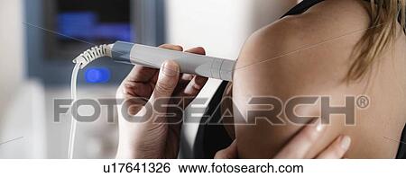 Physiotherapy laser treatment View Large Photo Image Stock Photograph - Physiotherapy laser treatment. Fotosearch