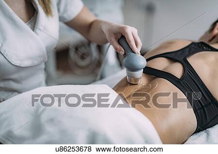 Stock Photo - Physiotherapy ultrasound treatment. Fotosearch