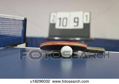 Stock Image - Ping pong ball and bat. Fotosearch