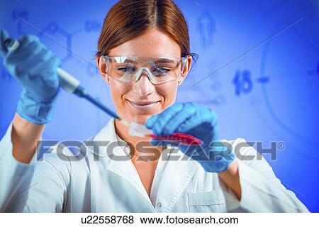 Stock Photo - Pipetting sample. Fotosearch