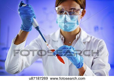 Pipetting sample View Large Photo Image Stock Photo - Pipetting sample. Fotosearch