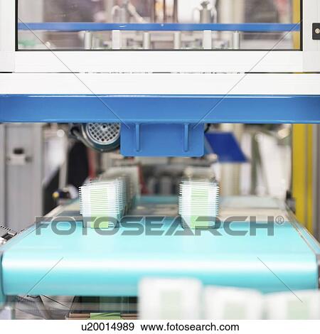 Stock Photo - Plastic container production line. Fotosearch