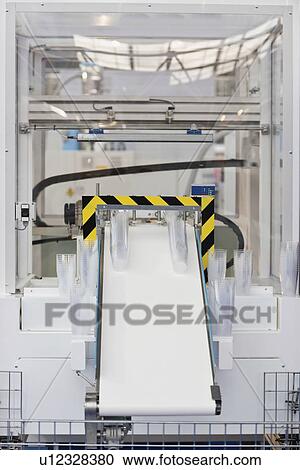 Plastic cup production line View Large Photo Image Stock Image - Plastic cup production line. Fotosearch
