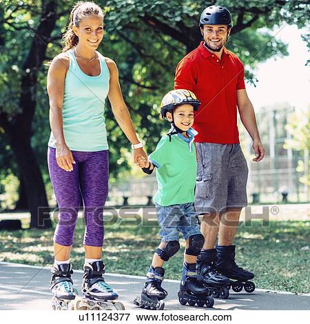 Portrait of family on roller skates in park View Large Photo Image Stock Photo - Portrait of family on roller skates in park. Fotosearch