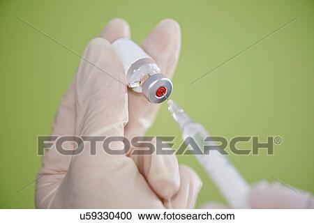 Stock Image - Preparing vaccine. Fotosearch