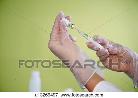 Preparing vaccine View Large Photo Image Stock Photo - Preparing vaccine. Fotosearch