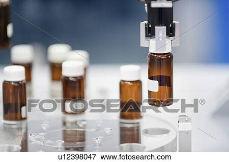 Stock Photo - Production line in pharmaceutical factory. Fotosearch