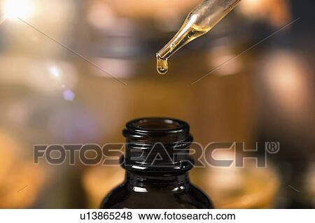 Propolis drop close up View Large Photo Image Stock Photo - Propolis drop close up. Fotosearch