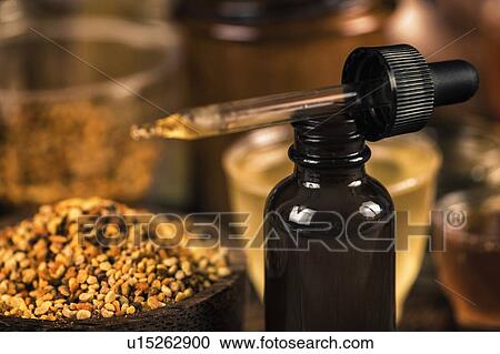 Stock Image - Propolis in brown glass dropper bottle. Fotosearch