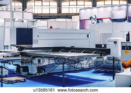 Stock Image - Punch laser machine. Fotosearch