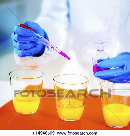 Stock Photo - Quality control of juice. Fotosearch