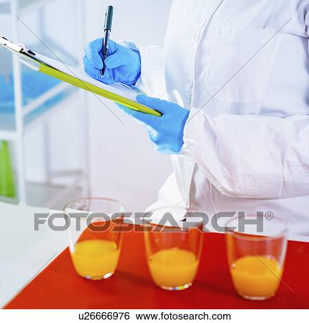 Quality control of juice View Large Photo Image Stock Photograph - Quality control of juice. Fotosearch