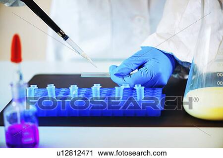 Stock Image - Quality control of milk. Fotosearch