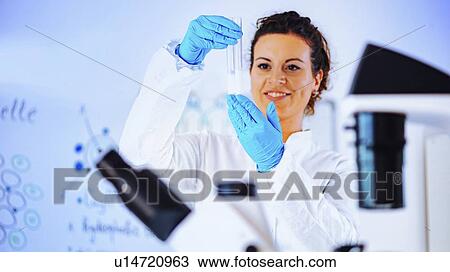 Stock Image - Quality control of milk. Fotosearch