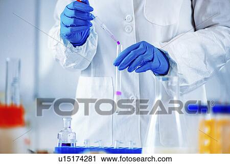 Stock Image - Quality control of milk. Fotosearch