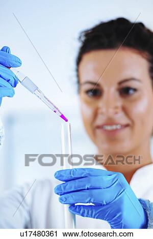 Stock Image - Quality control of milk. Fotosearch