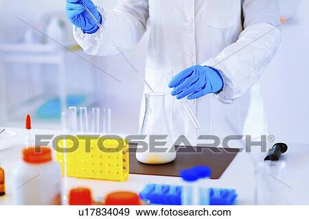 Stock Photo - Quality control of milk. Fotosearch