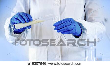 Stock Photograph - Quality control of milk. Fotosearch