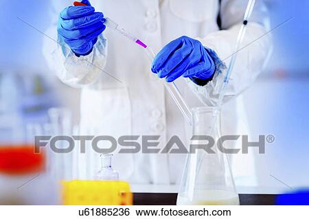 Stock Photograph - Quality control of milk. Fotosearch