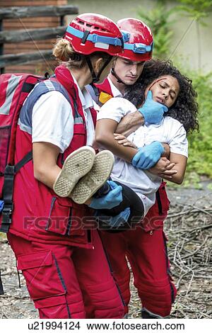 Rescue team evacuate woman from house View Large Photo Image Picture - Rescue team evacuate woman from house. Fotosearch