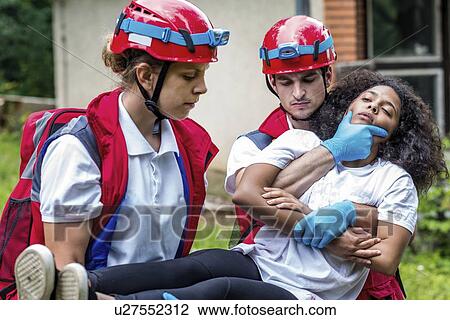 Rescue team evacuate woman from house View Large Photo Image Stock Image - Rescue team evacuate woman from house. Fotosearch