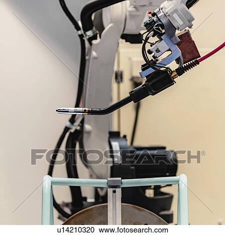 Stock Image - Robot welding system. Fotosearch