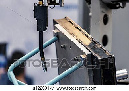 Stock Photo - Robot welding system. Fotosearch