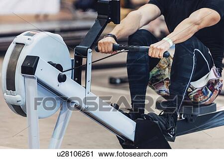 Stock Image - Rowing machine workout. Fotosearch