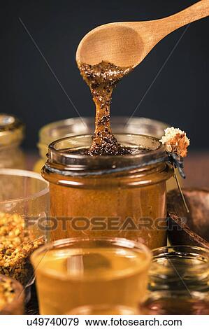 Stock Photo - Royal jelly honey with propolis and pollen. Fotosearch