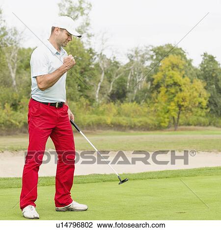Satisfied golfer after successful putting shot View Large Photo Image Stock Image - Satisfied golfer after successful putting shot. Fotosearch