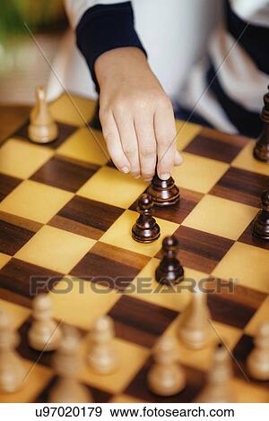Schoolboy playing chess View Large Photo Image Stock Photo - Schoolboy playing chess. Fotosearch