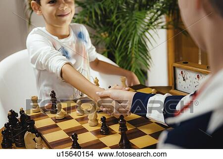Picture - Schoolboys playing chess. Fotosearch