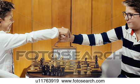 Schoolboys playing chess View Large Photo Image Stock Photo - Schoolboys playing chess. Fotosearch