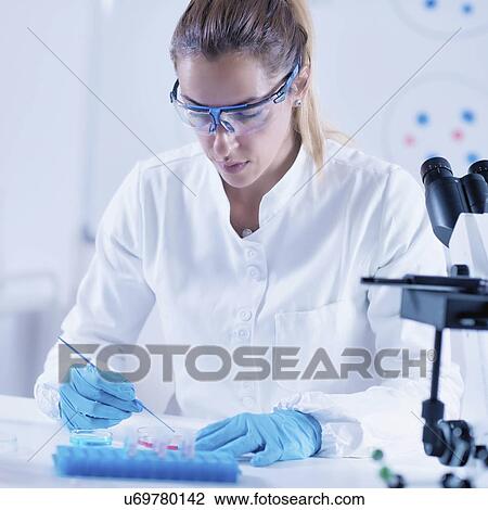 Stock Image - Science researcher in laboratory. Fotosearch