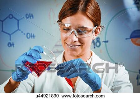 Scientist pouring sample View Large Photo Image Stock Image - Scientist pouring sample. Fotosearch