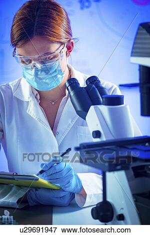 Stock Photo - Scientist taking notes. Fotosearch