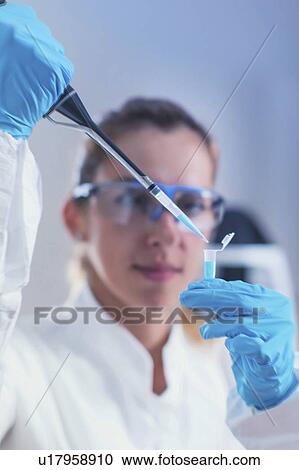 Scientist using micropipette View Large Photo Image Stock Image - Scientist using micropipette. Fotosearch
