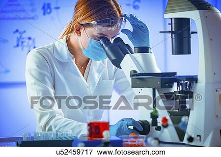 Scientist using microscope View Large Photo Image Stock Photo - Scientist using microscope. Fotosearch