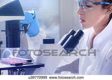 Stock Photo - Scientist working with cell culture. Fotosearch