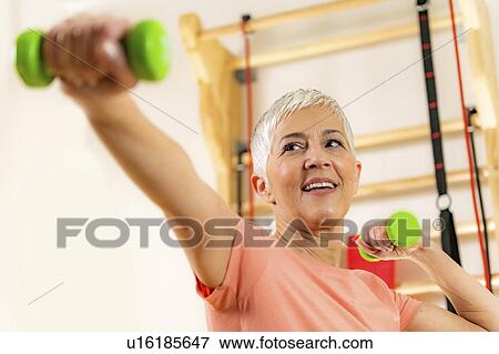 Stock Photo - Senior woman exercising. Fotosearch