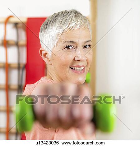 Senior woman exercising View Large Photo Image Stock Photograph - Senior woman exercising. Fotosearch
