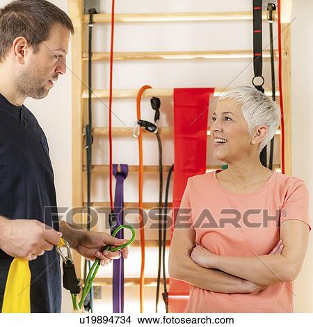 Senior woman with personal trainer View Large Photo Image Picture - Senior woman with personal trainer. Fotosearch