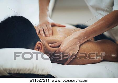 Stock Image - Shoulder massage. Fotosearch