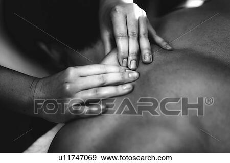 Shoulder massage View Large Photo Image Stock Photo - Shoulder massage. Fotosearch