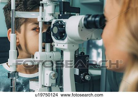 Picture - Slit lamp eye examination. Fotosearch