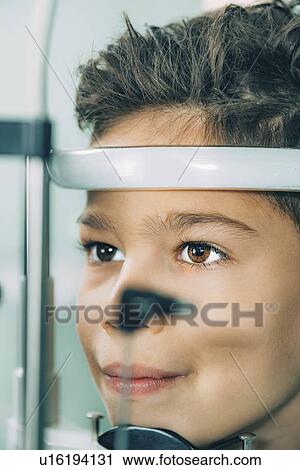 Stock Image - Slit lamp eye examination. Fotosearch